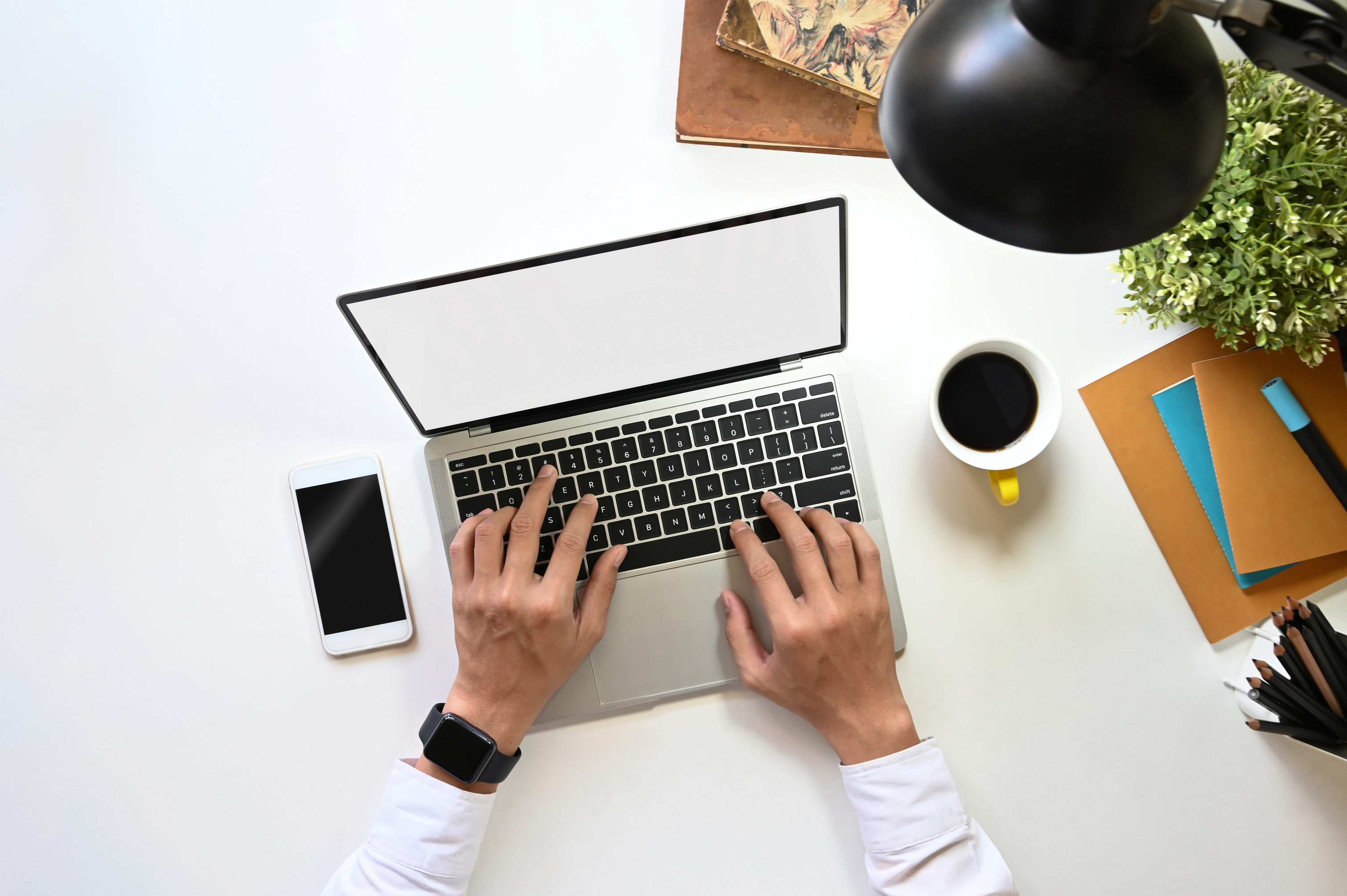 Man Typing on Laptop